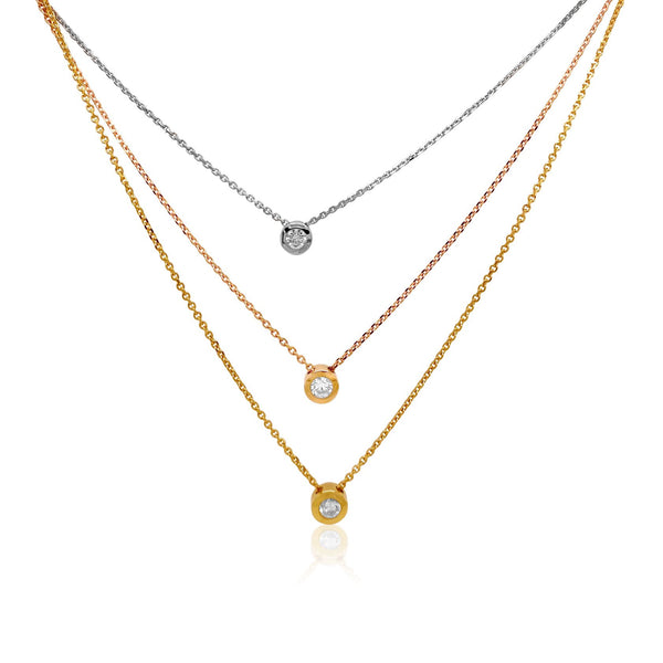 Three tone triple solitaire necklace