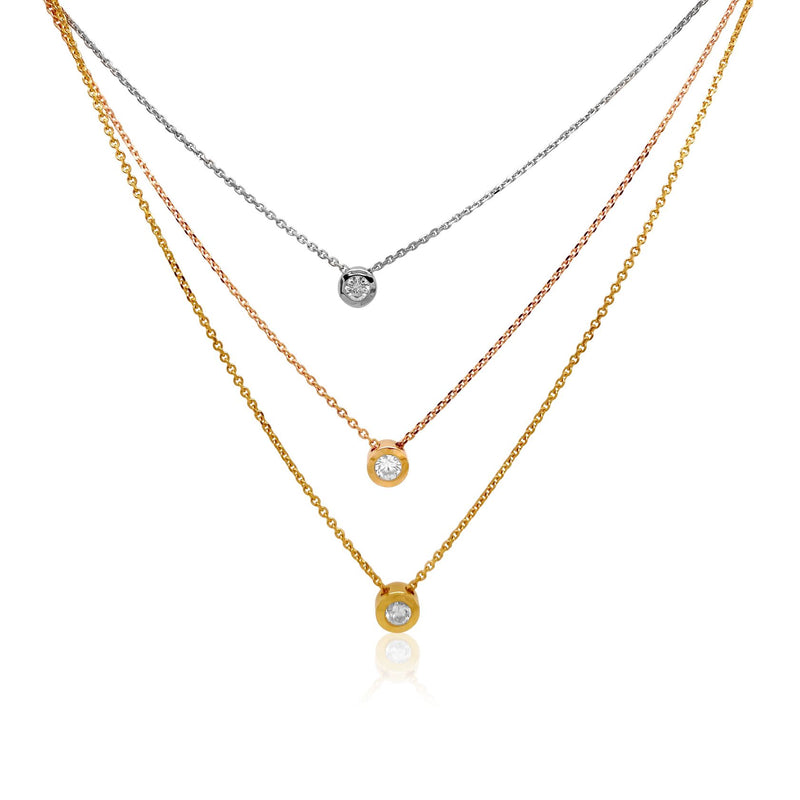 Three tone triple solitaire necklace